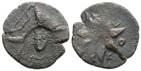 Pontos. Uncertain mint. Time of Mithradates VI Eupator circa 130-100 BC. Æ Bashlyk; countermarks: bow above and
 laureate head, facing slightly left, ...
