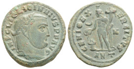 Licinius Æ Nummus. Antioch, AD 310-311. IMP C LIC LICINIVS P F AVG, laureate head right / GENIO IMPERATORIS; Genius standing left before lighted altar...