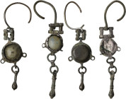Pair of silver pendant earrings with glass paste inlays. Byzantine to Migration Period. Length: 60 mm and 67 mm.