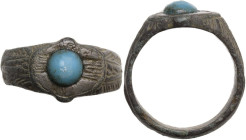 Bronze ring with light blue glass inlay, shoulders richly engraved with geometric patterns. Balkanic. Inner diameter: 18 mm.