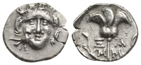 CARIA, Mylasa. Early-mid 2nd century BC. AR Drachm (15mm, 2.1 g). Pseudo-Rhodian type. Head of Helios facing; bird at cheek to left / Rose with buds t...