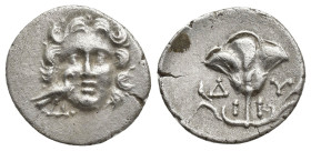CARIA, Mylasa. Circa 170-130 BC. AR Drachm (17mm, 2.3 g). Rhodian standard. Facing head of Helios; to lower left, eagle standing right / Rose with bud...