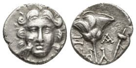 CARIA. Mylasa. Ca. 175-130 BC. AR drachm (14mm, 2 g). Ca. 175-150 BC. Head of Helios facing; eagle standing right at cheek to left / Ξ-A (month) / HΔ-...