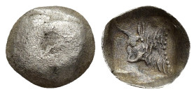 CARIA. Uncertain. Tetartemorion (9mm, 0.21 g) (Circa 5th century BC). Obv: Confronted heads of two bulls. Rev: Forepart of bull left within incuse squ...