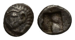 Ionia, Kolophon AR Tetartemorion. (5mm, 0.46 g) Circa 530-500 BC Archaic head of Apollo left / Irregular incuse square punch.
