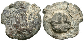 Precinto o plomo de saca. (Pb. 8,87g/25mm). Anv: Castillo. Rev: Posible cuartelado de castillos y leones. MBC-.