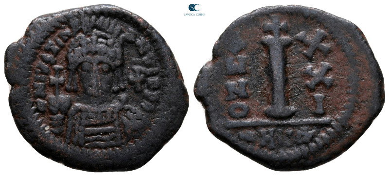 Justinian I AD 527-565. Theoupolis (Antioch)
Decanummium Æ

24 mm, 4,72 g

...