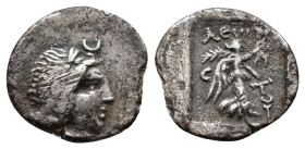 Karia, Stratonikeia. 25 BC-25 AD. Leon, magistrate. Laureate head of Hekate right, crescent above / Nike advancing right holding wreath; C-T across fi...