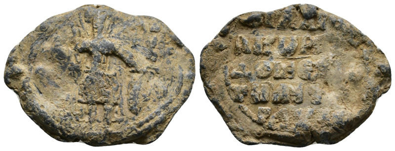 Byzantine lead seal. Domestikos, name illegible, c. IX cent.
Saint (Demetrios?)...