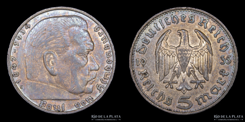 Alemania. 5 Reichsmark 1935 G. AG.900; 29.0mm; 13.90g. KM86 (XF) Pátina oscura
...