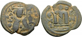 ISLAMIC. Arab-Byzantine (Imperial image) coinage . Circa 685-692. Fals (Bronze, 22 mm, 4.23 g, 6 h), Hims (Emesa). KAΛωN / ( bi-hims ) Facing bust of ...