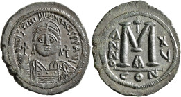 Justinian I, 527-565. Follis (Bronze, 39 mm, 23.25 g, 7 h), Constantinopolis, RY 15 = 541/2. D N IVSTINIANVS P P AVI Helmeted, diademed and cuirassed ...