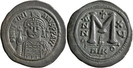 Justinian I, 527-565. Follis (Bronze, 39 mm, 23.37 g, 6 h), Nicomedia, RY 15 = 541/2. D N IVSTINIANVS P P AVI Helmeted, diademed and cuirassed bust of...