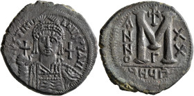 Justinian I, 527-565. Follis (Bronze, 33 mm, 20.51 g, 11 h), Theoupolis (Antiochia), RY 20 = 546/7. D N IVSTINIANVS P P AVI Helmeted, diademed and cui...