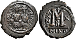 Justin II, with Sophia, 565-578. Follis (Bronze, 30 mm, 13.54 g, 6 h), Nicomedia, RY 10 = 574/5. D N IVSTINVS P P AVC Justin II, holding globus crucig...