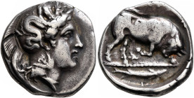 LUCANIA. Thourioi. Circa 400-350 BC. Stater (Silver, 21 mm, 7.80 g, 7 h). Head of Athena to right, wearing crested Attic helmet adorned, on the bowl, ...