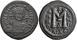 Justinian I, 527-565. Follis (Bronze, 35 mm, 20.63 g, 6 h), Nicomedia, RY 17 = 543/4. D N IVSTINIANVS P P AVC Helmeted and cuirassed bust of Justinian...