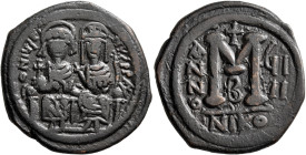 Justin II, with Sophia, 565-578. Follis (Bronze, 30 mm, 12.96 g, 7 h), Nicomedia, RY 9 = 573/4. D N IVSTINVS P P AVG Justin II, holding globus crucige...