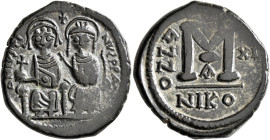 Justin II, with Sophia, 565-578. Follis (Bronze, 29 mm, 14.06 g, 7 h), Nicomedia, RY 11 = 575/6. D N IVSTINVS P P AV Justin II, holding globus crucige...