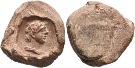 ROMAN. 2nd-3rd centuries. Seal (Terracotta, 18 mm, 1.73 g). Diademed and draped head of a young man (Alexander the Great?) to right. Rev. Papyrus impr...
