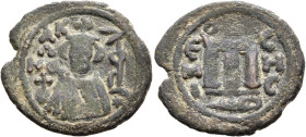 ISLAMIC, Umayyad Caliphate. temp. Mu'awiya I ibn Abi Sufyan, AH 41-60 / AD 661-680. Fals (Bronze, 22 mm, 4.26 g, 6 h), Arab-Byzantine type, Hims. Arab...