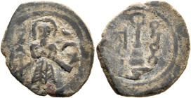 ISLAMIC, Umayyad Caliphate. temp. 'Abd al-Malik ibn Marwan, AH 65-86 / AD 685-705. Fals (Bronze, 20 mm, 2.52 g), 'Standing Caliph' type, Harran (Carrh...