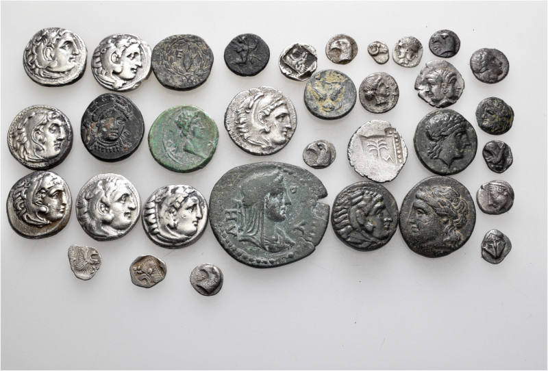 A lot containing 33 silver and bronze coins. Including: Greek and Roman Provinci...