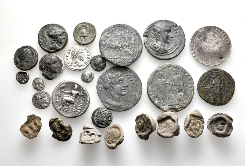 A lot containing 26 silver and bronze coins and lead seals. Including: Greek, Ro...