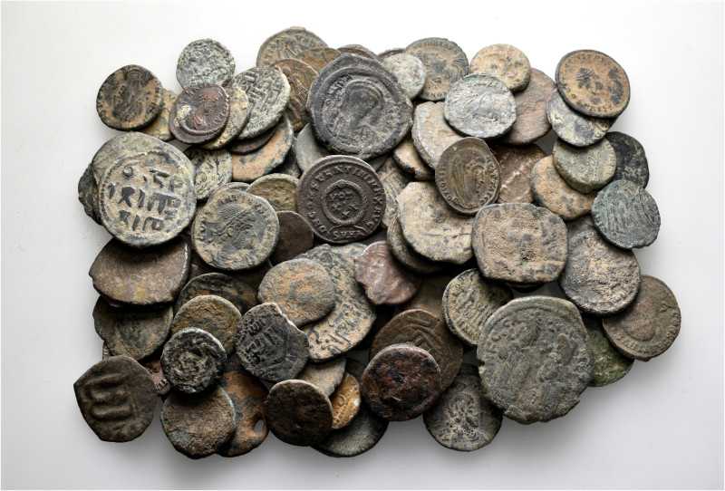 A lot containing 100 bronze coins. Including: Roman, Byzantine, Islamic. Fair to...