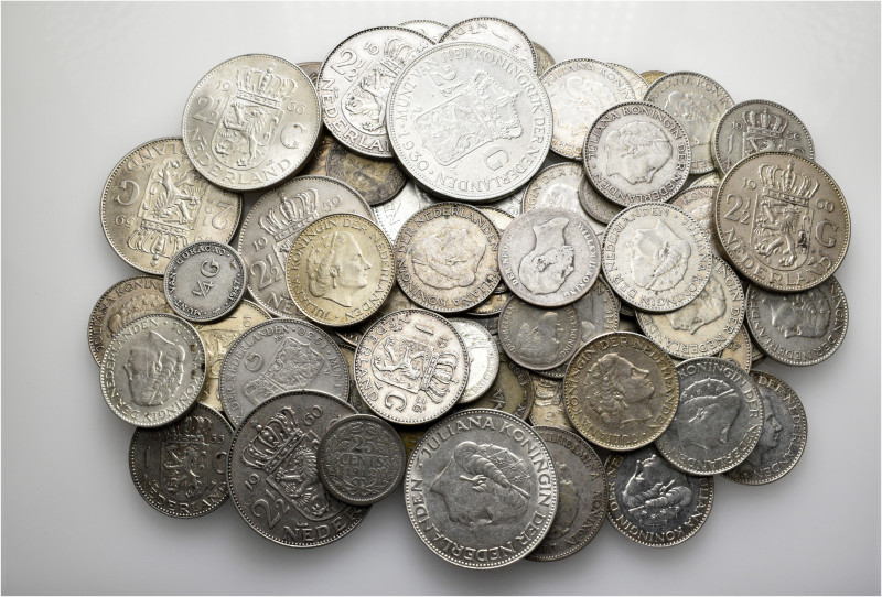 A lot containing 78 mainly silver coins (465 g). Mainly: Netherlands. About very...