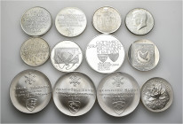 A lot containing 12 silver medals (ca. 258 g). Mostly: Switzerland. Uncirculated. LOT SOLD AS IS, NO RETURNS. 12 medals in lot.