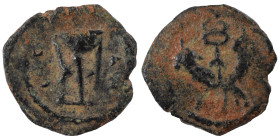 GREEK. Uncertain (?). Ae (bronze, 0.38 g, 11 mm). Tripod. Rev. Caduceus. Nearly very fine.