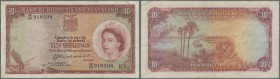 Rhodesia & Nyasaland: 10 Shillings 1961 P. 20, light folds, no holes or tears, condition: F+ to VF-.