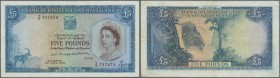 Rhodesia & Nyasaland: 5 Pounds 1959 P. 22, several folds in paper but probably pressed but no holes or tears, not repaired, still strong colors on fro...
