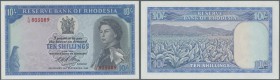 Rhodesia: 10 Shillings 1968 P. 27. The note with portrait of Queen Elizabeth II is in great uncirculated condition with crisp paper and bright colors....