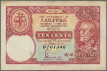 Sarawak: 10 Cents 1940 P. 25b, used with light folds and staining at upper and lower border, still strong paper and colors. Condition: F+ to VF-.