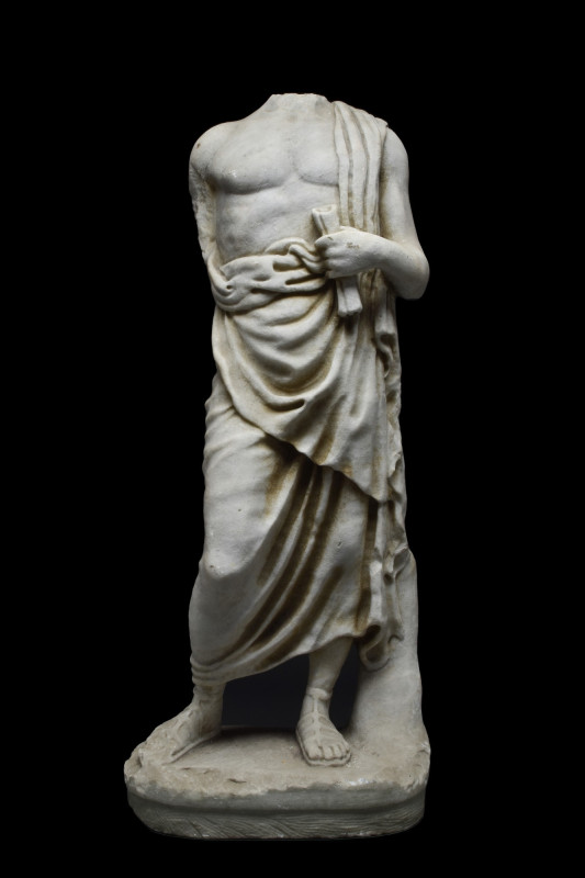ROMAN MARBLE MALE TOGATUS TORSO ON BASE
Ca. 200 AD. A marble figure of a male w...