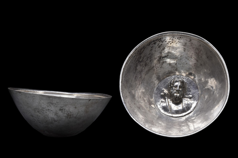 RARE ROMAN SILVER BOWL WITH EMBOSSED ZEUS MEDALLION
Ca. 300 AD. A stunning silv...