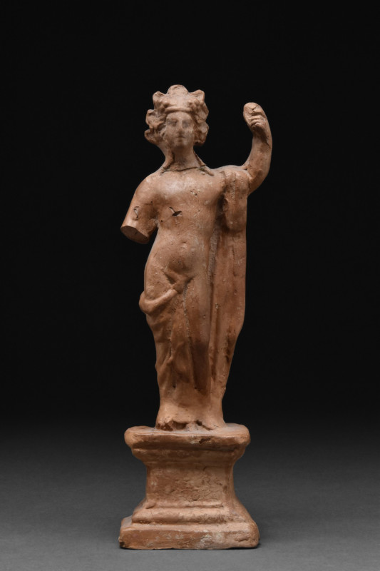 ROMAN TERRACOTTA STATUETTE OF BACCHUS
Ca. 1-100 AD. A terracotta statuette of a...