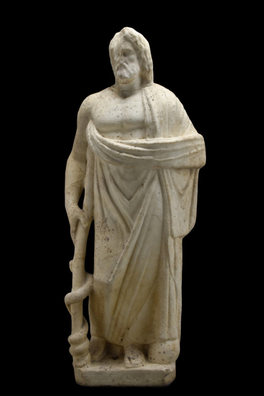 LARGE ROMAN MARBLE FIGURE OF ASCLEPIUS
Ca. 200 AD. A magnificent marble figure ...