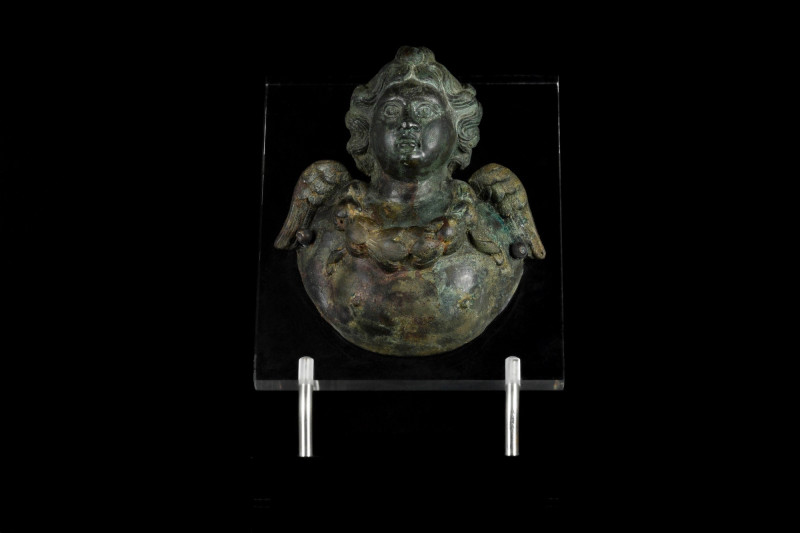 ANCIENT ROMAN BRONZE PHALERA WITH CUPID
Ca. 200-300 AD. A bronze-cast phalera m...