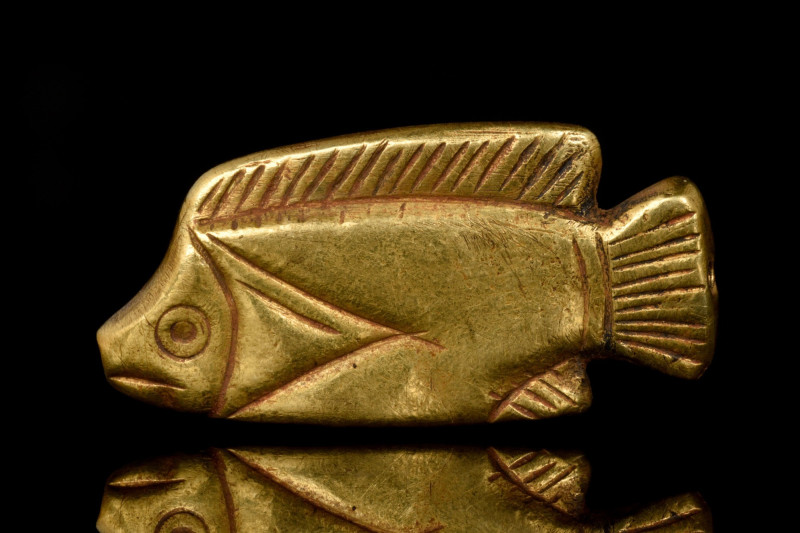 EGYPTIAN GOLD FISH AMULET
New Kingdom, Ca. 1550-1070 BC. A golden amulet in the...