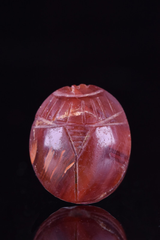 ANCIENT EGYPTIAN CARNELIAN SCARAB
Ca. 664-332 BC. A carnelian scarab with a rou...