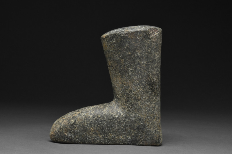 BACTRIAN STONE FOOT IDOL
Ca. 1st millennium BC. A carved stone foot and lower l...