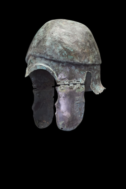 GREEK CHALCIDIAN BRONZE HELMET
Ca. 550-300 BC. A bronze helmet of Chalcidian ty...