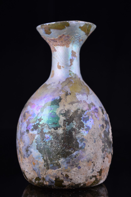 ANCIENT ROMAN GLASS FLASK
Ca. 200-300 AD. A beautiful yellowish flask comprisin...