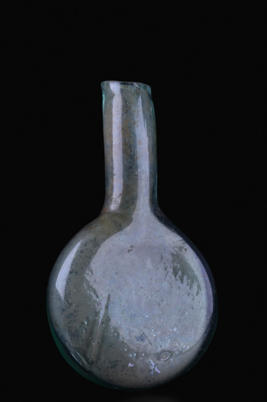 ANCIENT ROMAN GLASS AMPULLA
Ca. 100-300 AD. A finely blown ampulla flask of aqu...