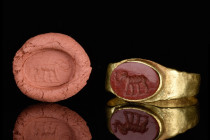 A ROMAN GOLD AND CARNELIAN INTAGLIO RING DEPICTING AN ELEPHANT