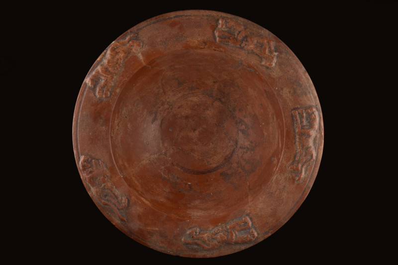 ROMAN TERRA SIGILLATA BOWL WITH ANIMALS
Ca. 100 AD. A rich red terra sigillata ...