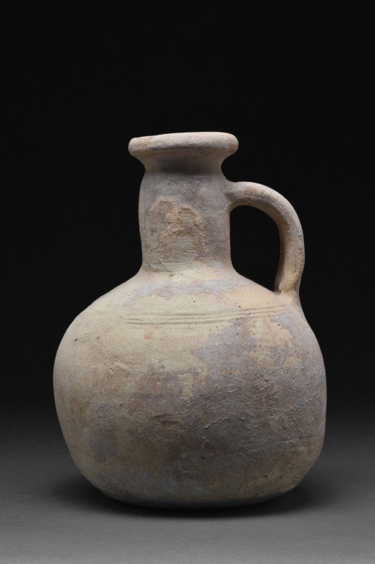 ROMAN TERRACOTTA JUG WITH HANDLE
Ca. 100-300 AD. A terracotta one-handled jug c...